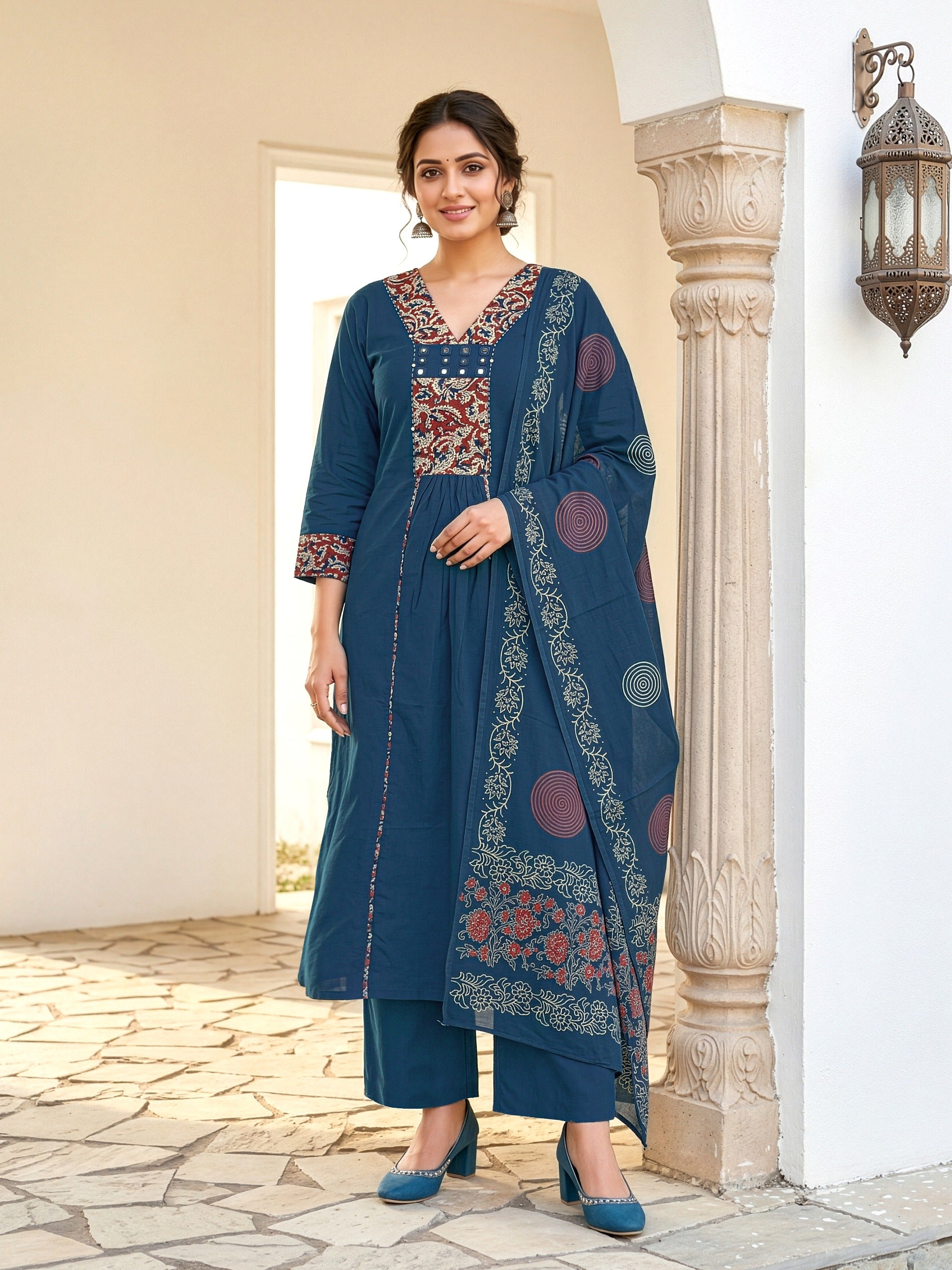 A-line kurta with decorative embroidered yoke, matching palazzo pants, and a printed dupatta.