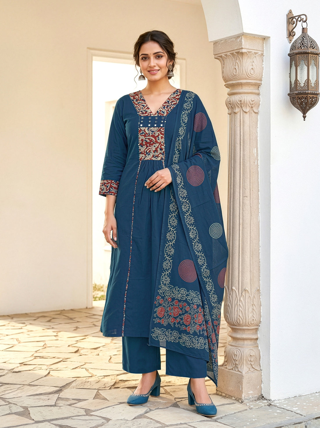 A-line kurta with decorative embroidered yoke, matching palazzo pants, and a printed dupatta.