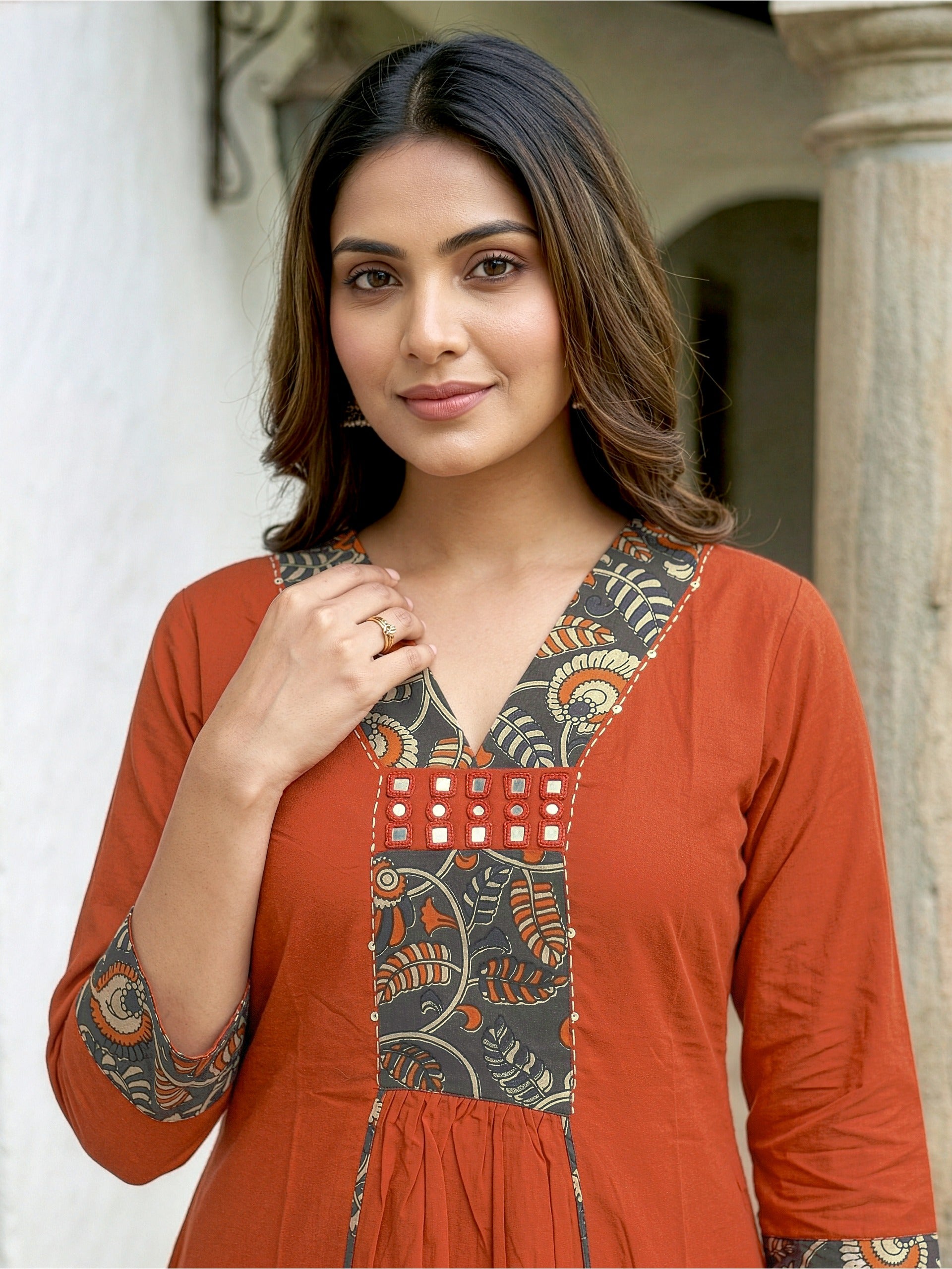 A-line kurta with decorative embroidered yoke, matching palazzo pants, and a printed dupatta.
