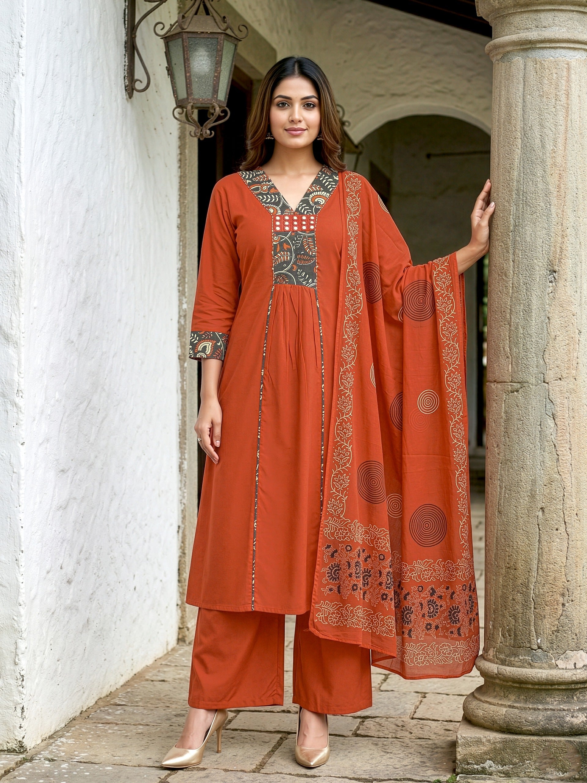 A-line kurta with decorative embroidered yoke, matching palazzo pants, and a printed dupatta.