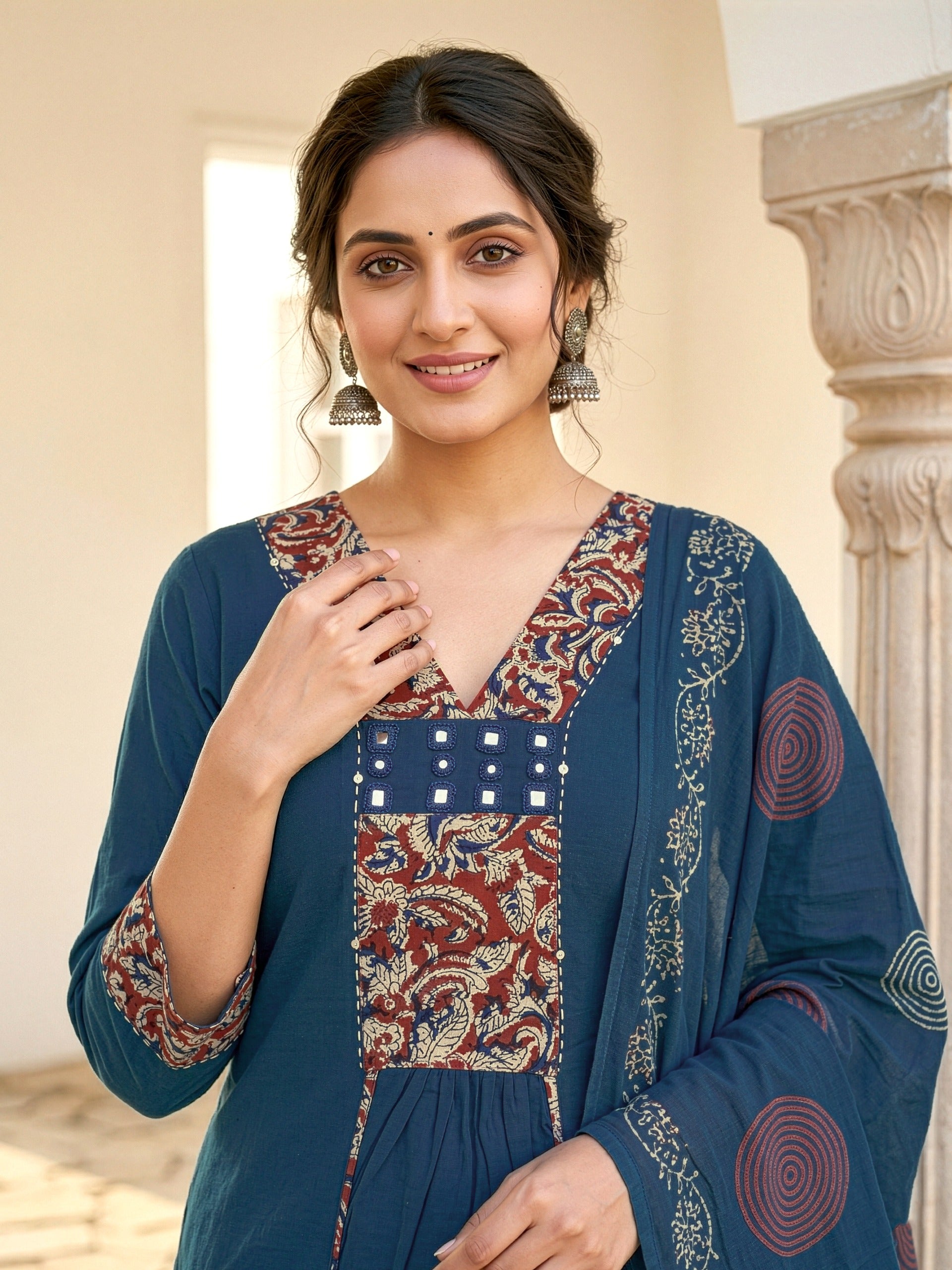 A-line kurta with decorative embroidered yoke, matching palazzo pants, and a printed dupatta.