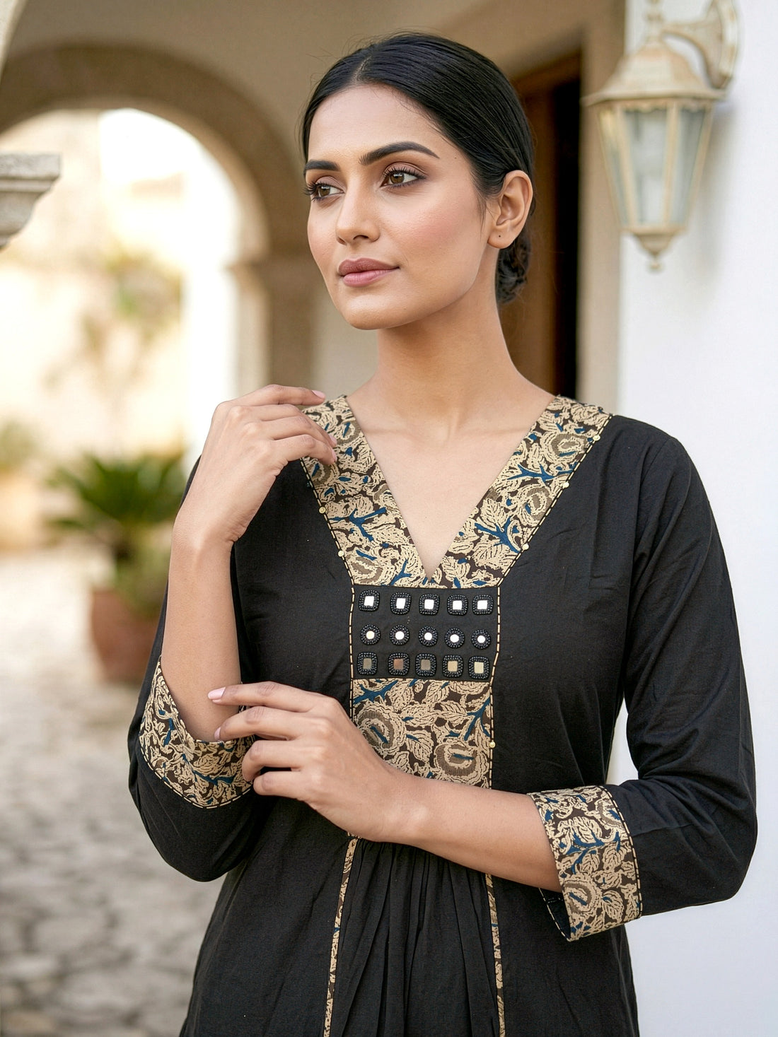 A-line kurta with decorative embroidered yoke, matching palazzo pants, and a printed dupatta.