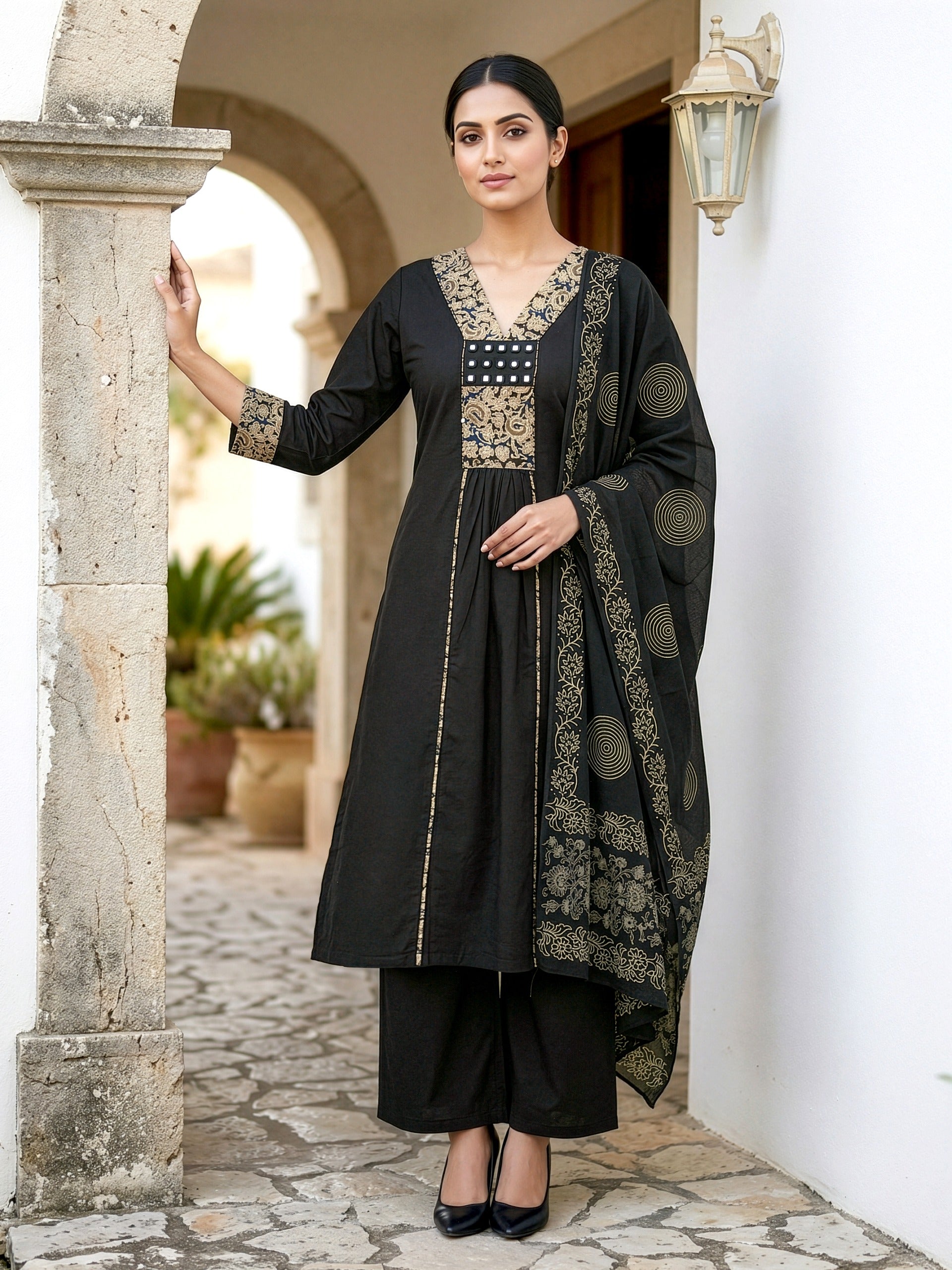 A-line kurta with decorative embroidered yoke, matching palazzo pants, and a printed dupatta.